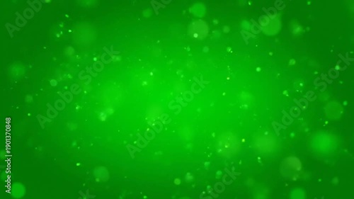 Vibrant green particles dance in a mesmerizing video display of light and energy