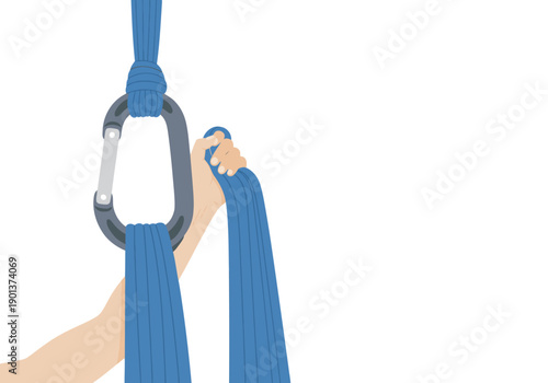 A hand secures a blue yoga strap to a carabiner. Clean, modern studio setting. Focus on texture and grip. Ideal for fitness and wellness visuals.