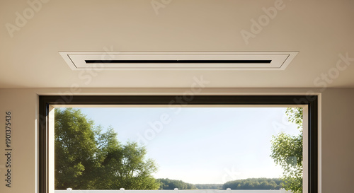 Air conditioning vent above a window with a view of trees