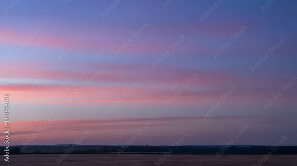 Fototapeta premium Serene sunset casting warm glows over the horizon