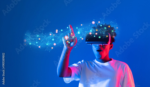 Obraz na plátně A young individual immersed in virtual reality explores the intersection of technology and social media, showcasing engagement and interaction in a vibrant digital landscape
