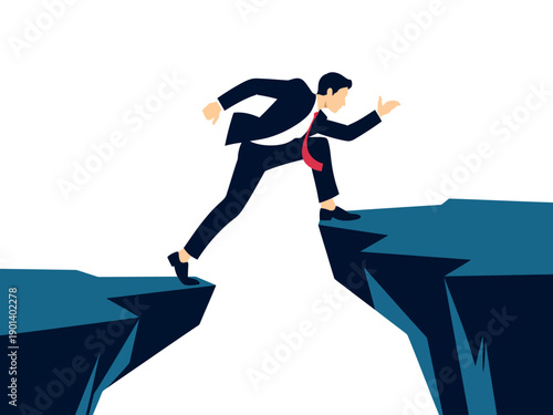 A businessman in a suit is jumping over a deep chasm between two cliffs, symbolizing a challenging career move or risk.