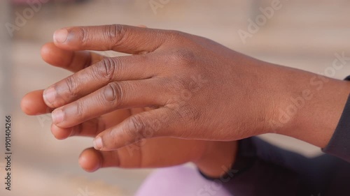 Wallpaper Mural closeup sandy hands splayed outdoors, child playing with beach sand under warm sunlight, granules clinging to palms and fingers, playful motion releasing grains, tactile summer texture and curiosity Torontodigital.ca