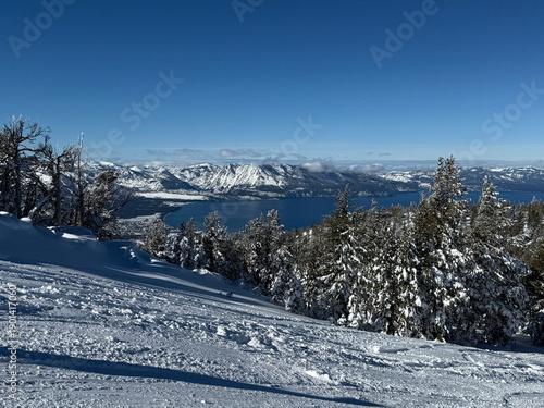 Views of Lake Tahoe and snow-covered trees after a snowstorm on a bluebird winter day at Heavenly Ski Resort in South Lake Tahoe