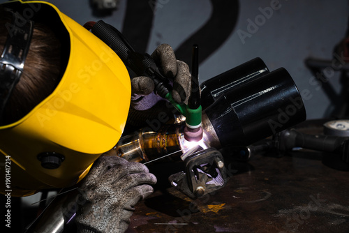 фотографія Precision TIG welding on custom exhaust pipe using argon by welder