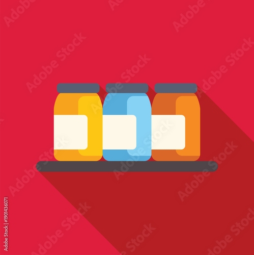 Three colorful jars of provisions standing on a shelf with long shadow
