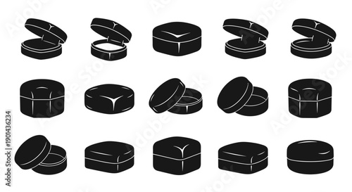 Collection of various black capsules and tablets for medication