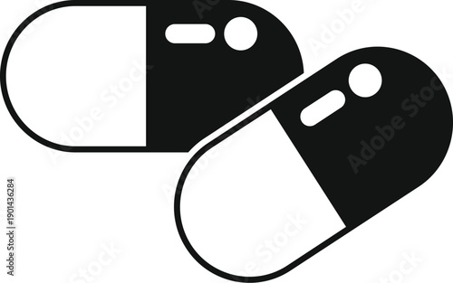 Two black and white capsules representing medicine, healthcare, and pharmacy