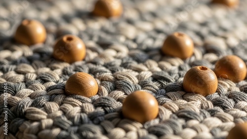 Close-up of Smooth Wooden Beads Resting on a Textured, Braided T