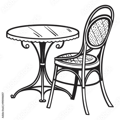 A vintage-style table and chair set with intricate designs on the furniture legs