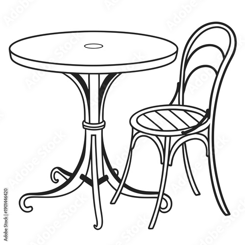 A vintage style table and chair set with intricate metalwork and a round tabletop