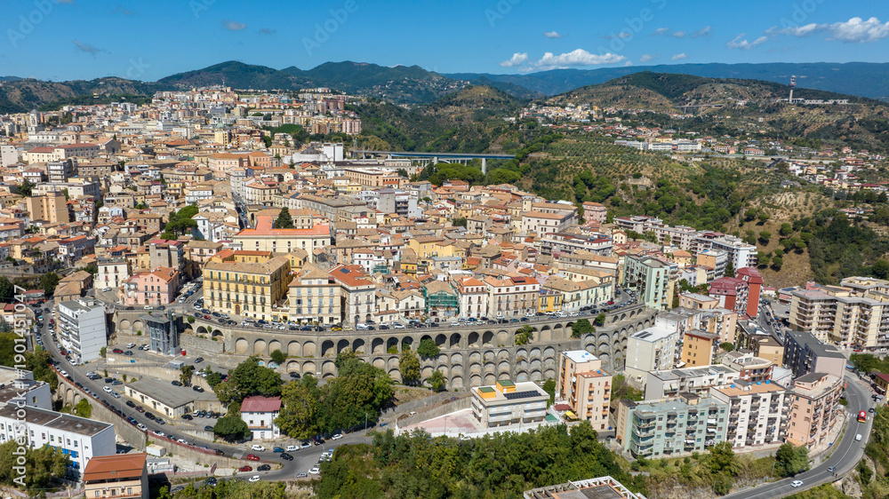 Obraz premium Aerial view of the historic center of Catanzaro, located in southern Italy. It is the regional capital of Calabria and is perched on the hills. It is a sunny summer morning.