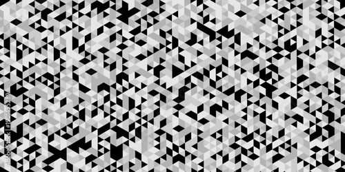 Triangle geometric pattern isolated on modern design, abstract image showcases a dense repeating pattern of small angled in varying shades of gray and black creating a textured effect.