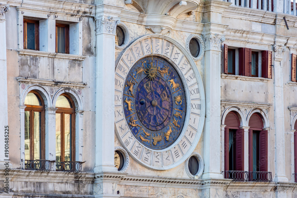 Obraz premium Ancient astronomical clock on St. Mark's square in center of Venice, Italy