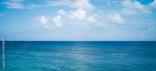 Photography Blue caribbean sea water, tropical beach with white clouds background