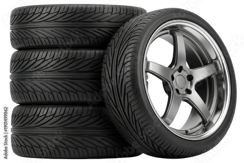 Wallpaper Mural Automobile tires stacked and a single performance tire mounted on a polished silver alloy rim displayed in a dark setting Torontodigital.ca