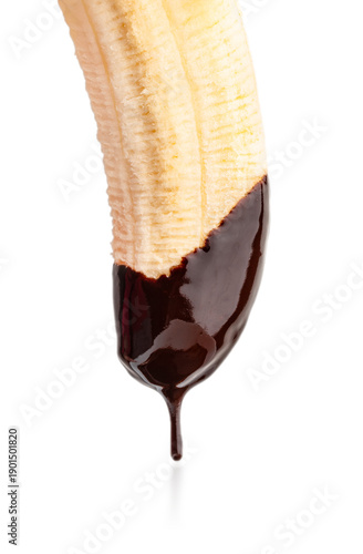 Fresh banana dipped in melted dark chocolate with dripping drop isolated on white background, sweet dessert concept.