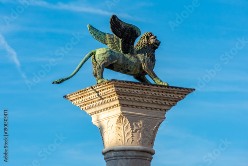 Fotografie Winged lion sculpture (symbol of Venice) on San Marco column at St