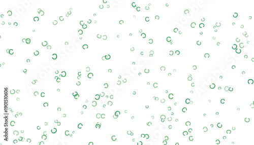 A beautiful green confetti scattered on a white background creating a festive atmosphere.