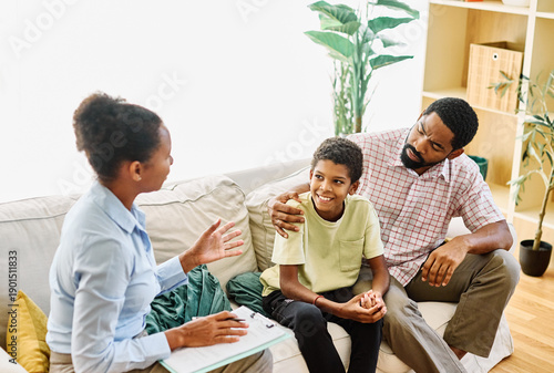 Wallpaper Mural Fatherwith his teenage son boy at meeting with social worker, psychologist discussing mental health family sitting on sofa in psychotherapist office Torontodigital.ca