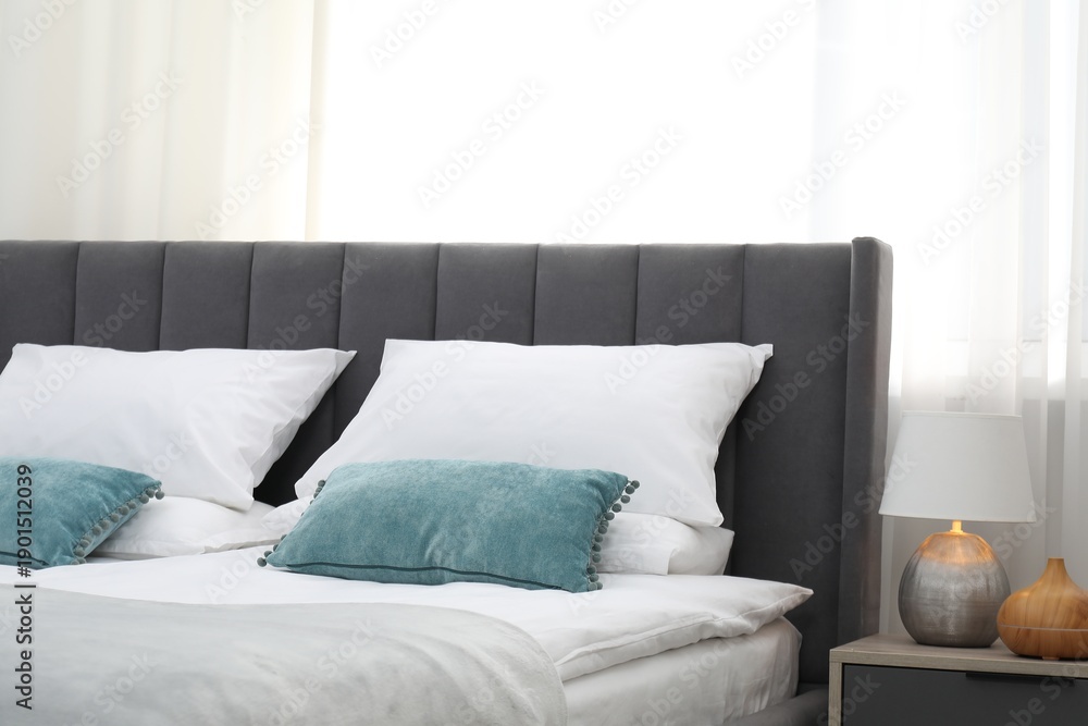 Fototapeta premium Comfortable bed with clean linens in bedroom