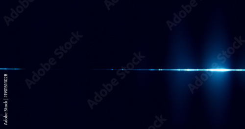 Fotografie Abstract cinematic lens flare with bright light burst and star rays, isolated on black background