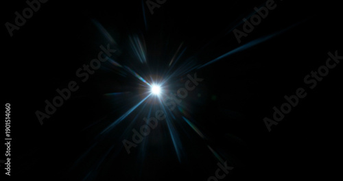 Fotografie Abstract cinematic lens flare with bright light burst and star rays, isolated on black background