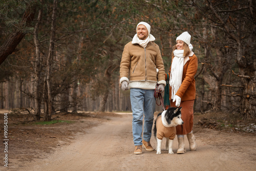 Young couple with Husky dog...