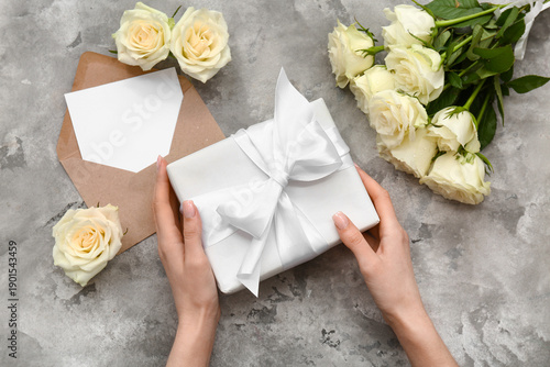 Female hands with gift box,...