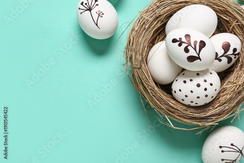 Nest with Easter eggs on tu...
