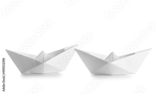 Origami boats on white back...