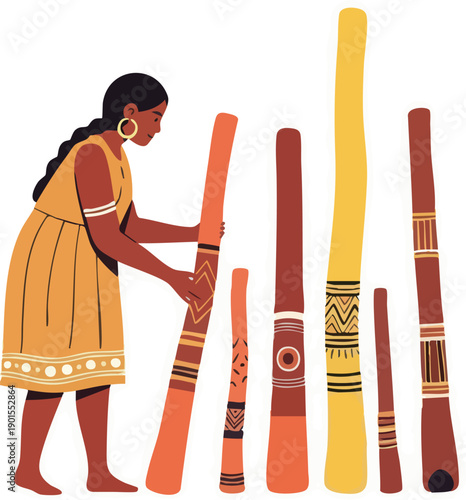 Woman holding traditional Aboriginal didgeridoos.