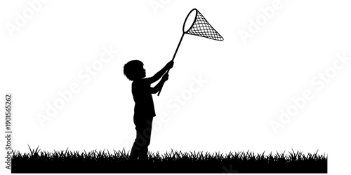 A silhouette of a child standing in a grassy field, holding a butterfly net raised high above their head, as if ready to catch something
