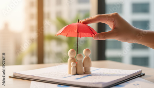 Wallpaper Mural Family Protection: Hand Holding Umbrella Over Wooden Figures Torontodigital.ca