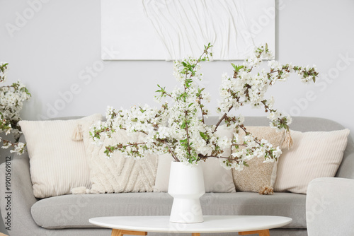 Vase with flowering branche...
