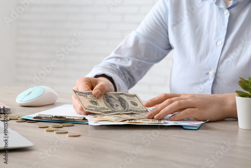 Businesswoman with dollar b...