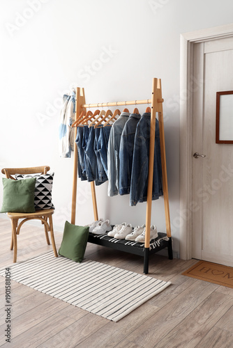 Rack with denim clothes nea...