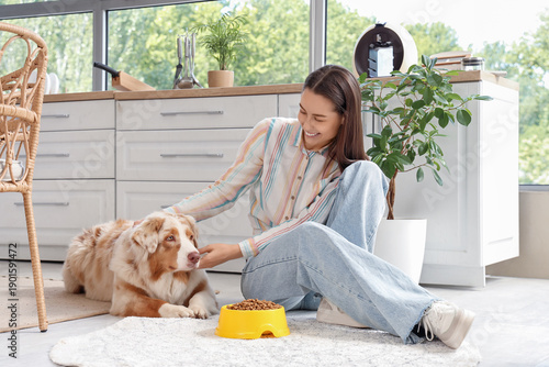 Young woman feeding Austral...
