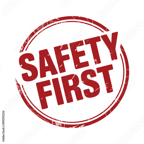 A red safety first stamp on a white background
