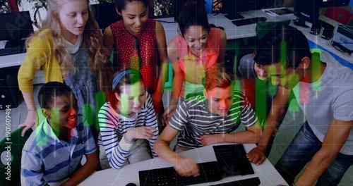 Huddling eight students leaning and pointing at monitor in school lab with keys green red overlay