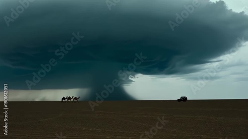 Dramatic desert scene with ominous storm cloud, camels, and a vehicle under a pale sky