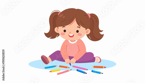 Adorable little girl in a pink sweater playing with a set of colored pencils, illustrating a fun and creative learning process