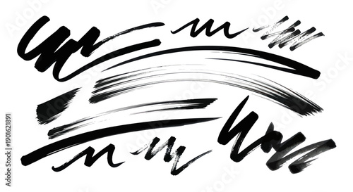 Collection of Black Ink Brush Strokes and Scribbles on White Background.