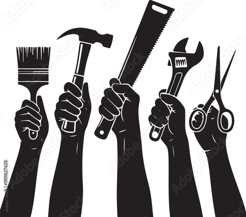 Raised hands holding tools for labour day and workers rights celebration.