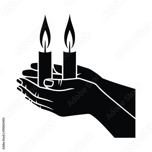 Hand cradling two lit candles in a symbolic gesture