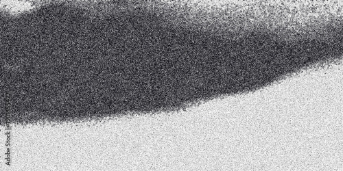 Abstract monochromatic textured background with a gradient of granular noise and a dark organic cloud formation against a light speckled surface for creative design