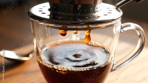 Wallpaper Mural Vietnamese Coffee Dripping Slowly Into Glass Mug Close Up. Torontodigital.ca