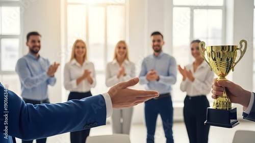 A group of colleagues celebrating and applauding in an office setting
