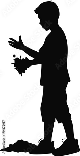 Silhouette Of A Boy Holding A Handful Of Dirt