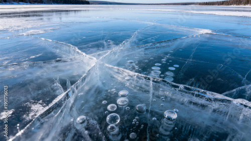 Frozen lake surface with radial cracks and air bubbles